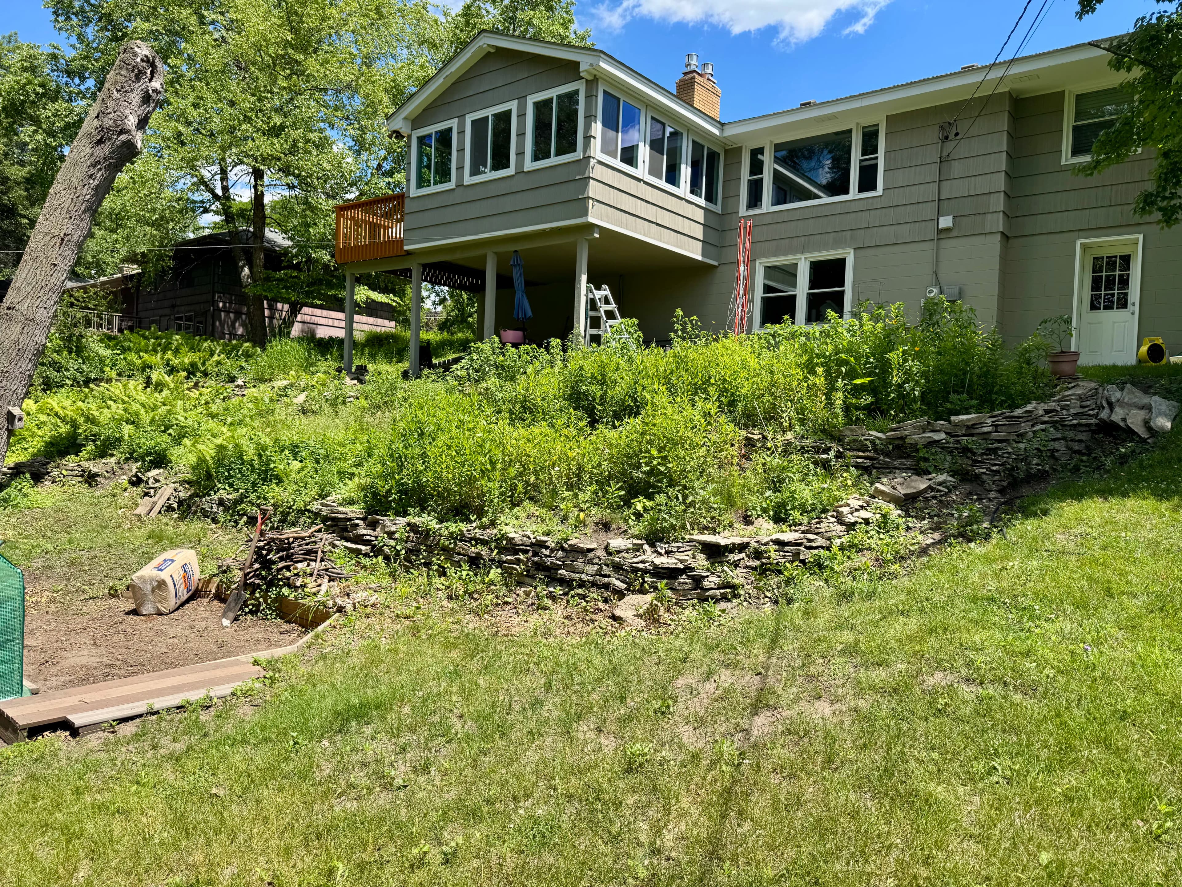 Project Terraced Boulder Retaining Walls and Steps Underway in Hopkins image