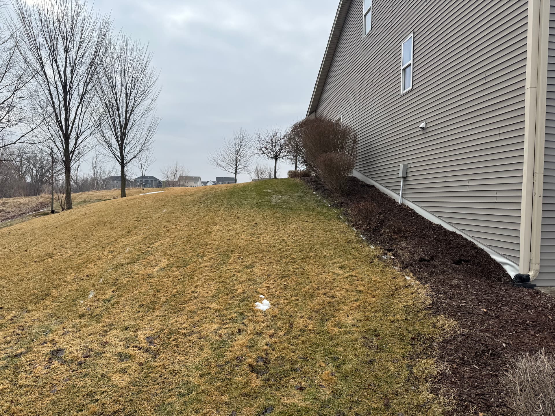 Hillside Excavation and Boulder Retaining Wall for Shed Pad