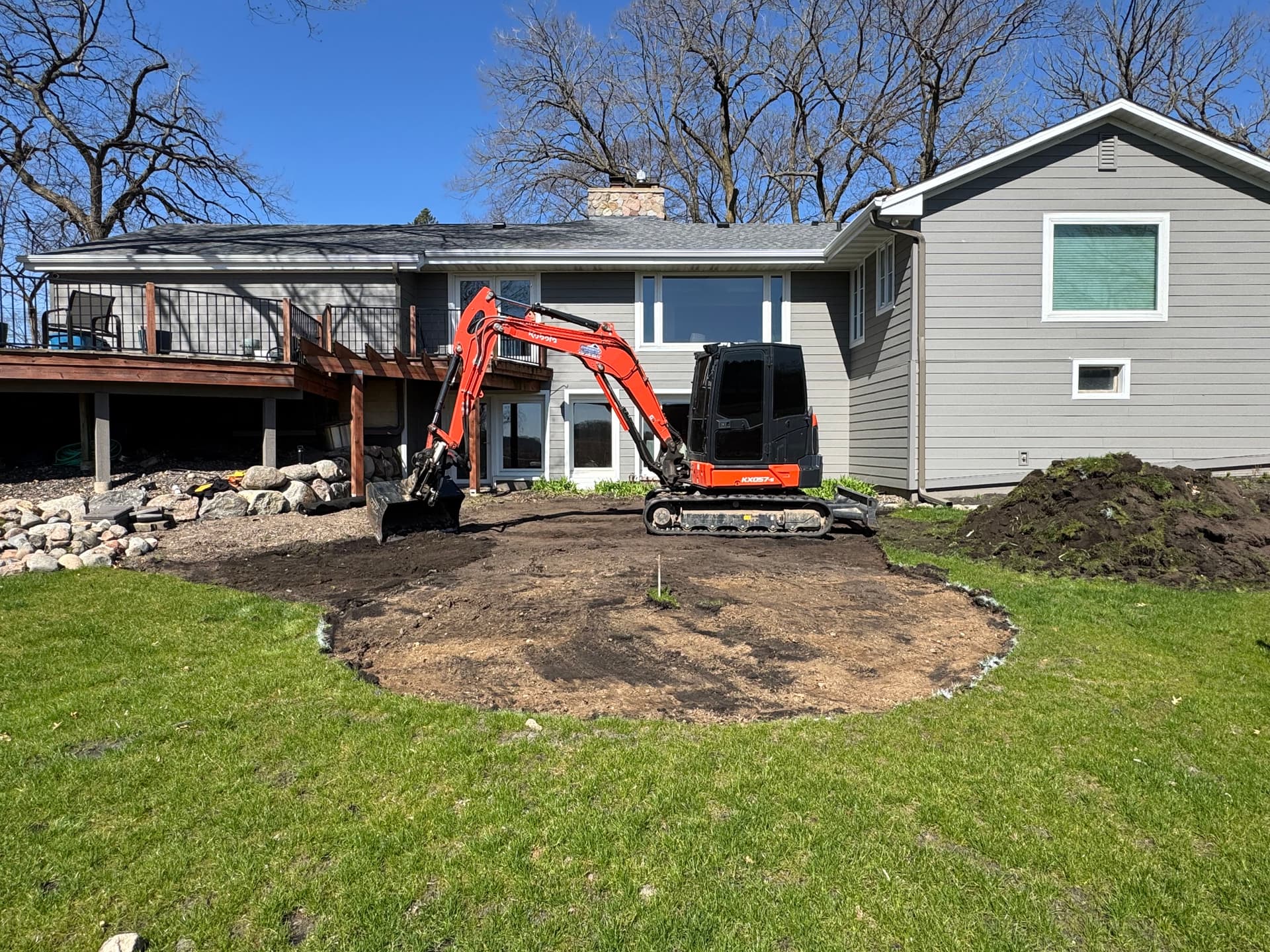 paver patio and boulder wall prep underway in wayzata image