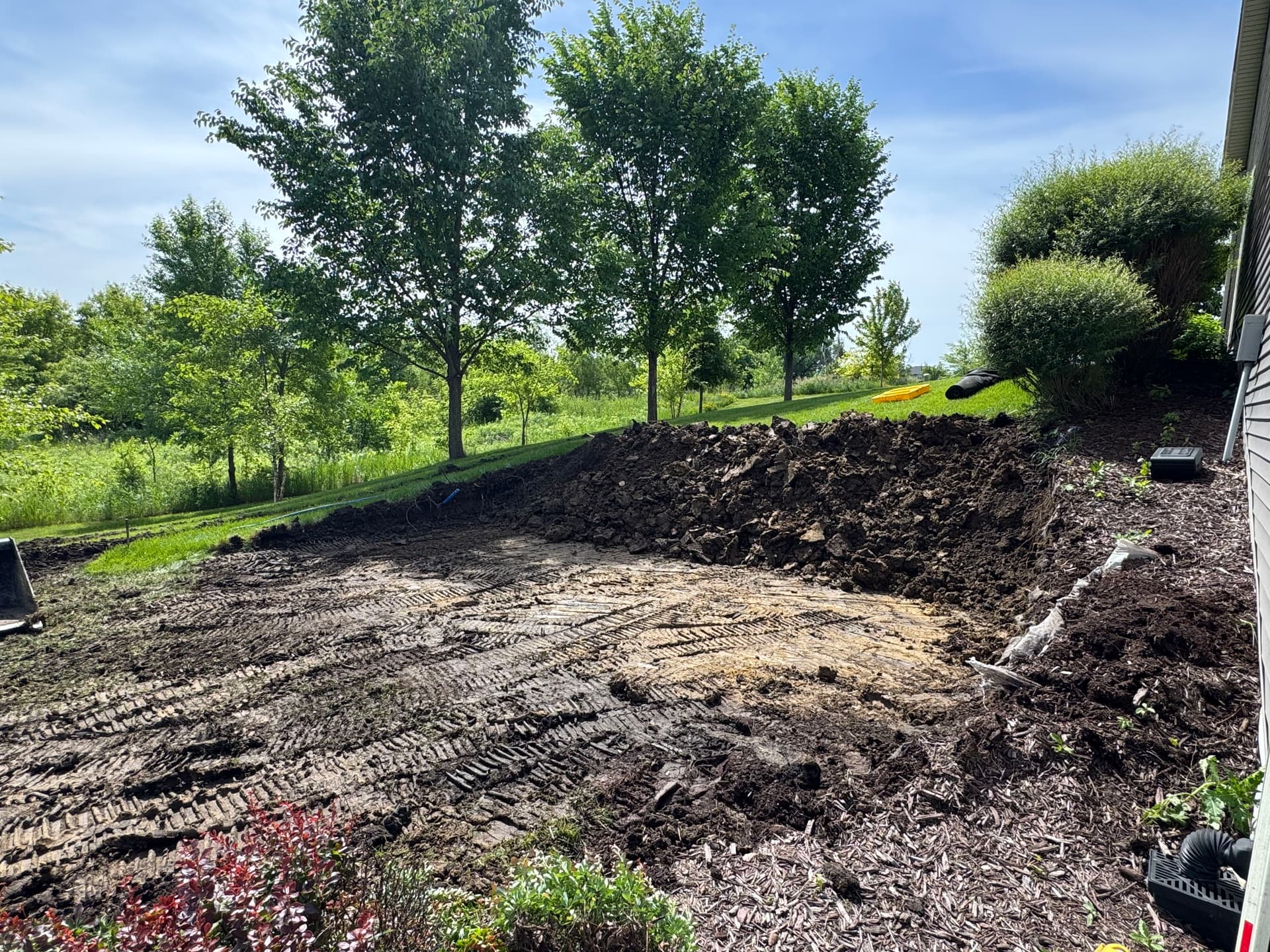 Hillside Excavation and Boulder Retaining Wall for Shed Pad
