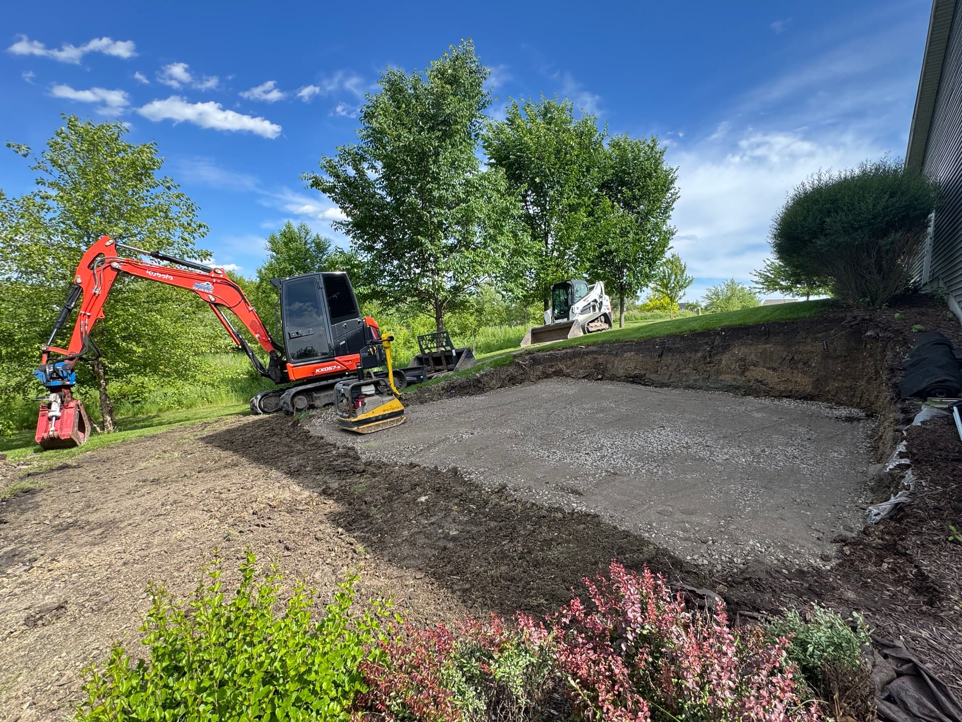 Hillside Excavation and Boulder Retaining Wall for Shed Pad