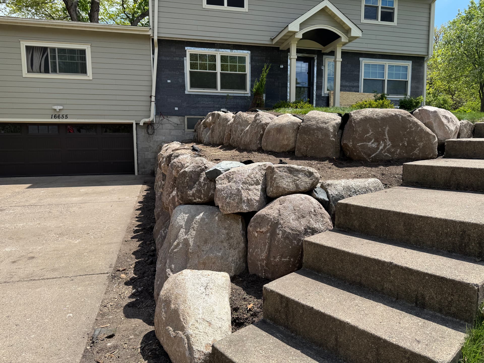 Gallery photos for Failing Timber Wall Replaced with Boulder Retaining Wall in Wayzata: Image #1